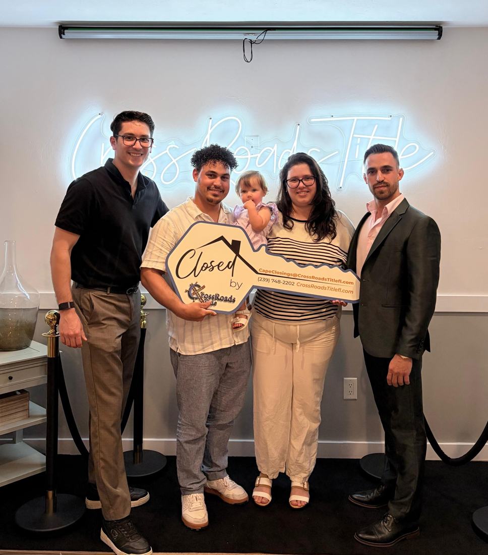 Family celebrating their closing with Marco