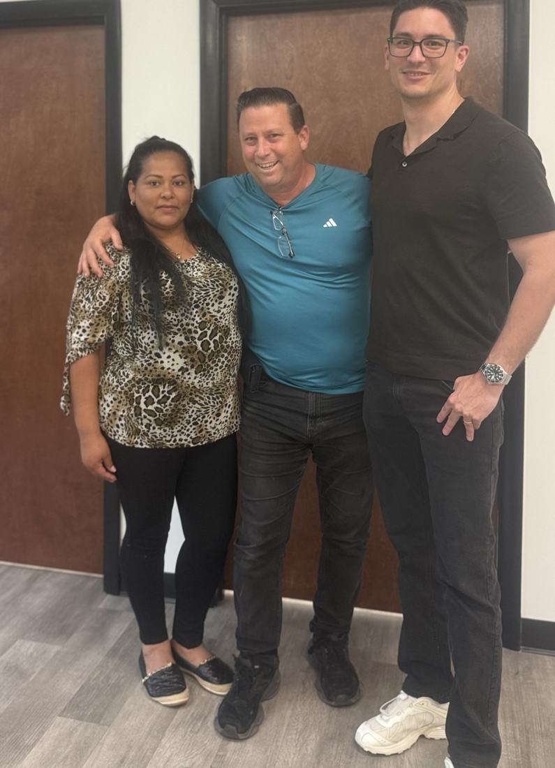 Clients with Marco after signing their loan